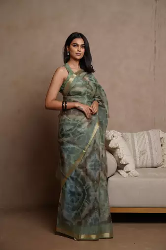 Dusty green kota doria polyester shibori print golden zari border saree