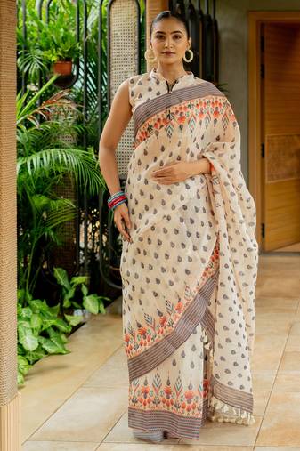 Cream cotton digital block ikkat printed silver zari border tassels saree