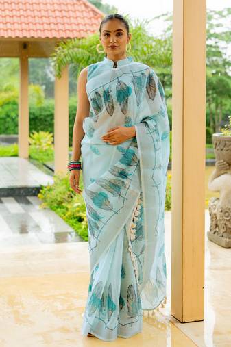Light turquoise cotton blend digital leaf print silver zari border tassels saree