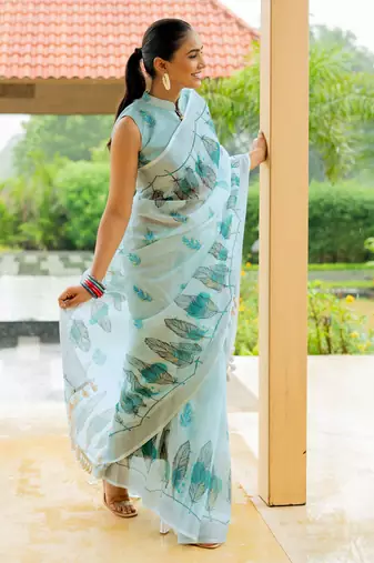 Light turquoise cotton blend digital leaf print silver zari border tassels saree