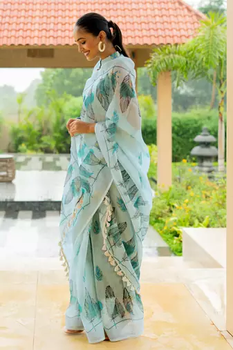 Light turquoise cotton blend digital leaf print silver zari border tassels saree