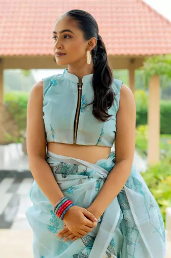Light turquoise cotton blend digital leaf print silver zari border tassels saree