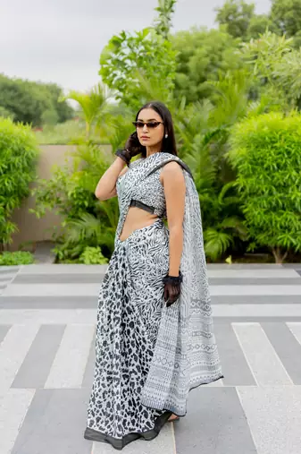 White poly cotton floral print satin stripes zari border saree