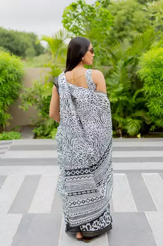 White poly cotton floral print satin stripes zari border saree