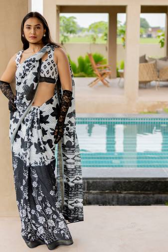 White poly cotton floral print satin stripes zari border saree