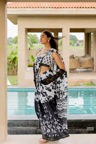 White poly cotton floral print satin stripes zari border saree