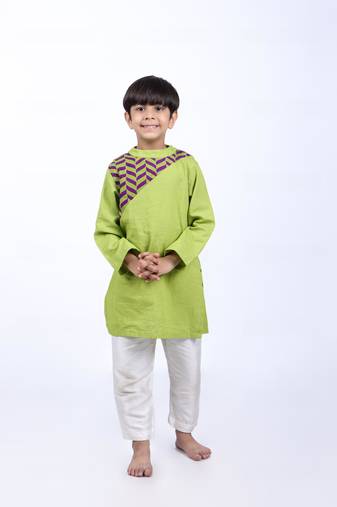 Green kurta with purple and green printed yolk with white pyjama