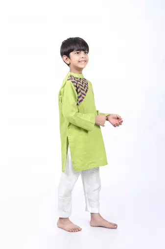 Green kurta with purple and green printed yolk with white pyjama