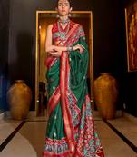 Dark green patola printed silk blend saree