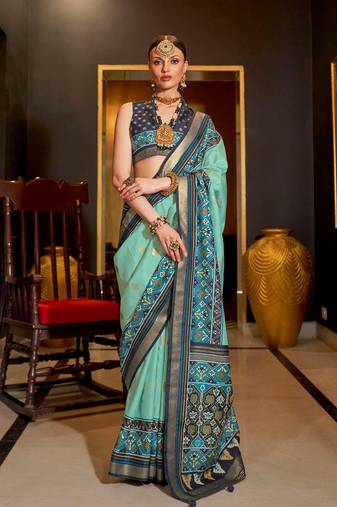 Sea green patola printed silk blend saree