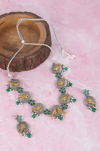 Dual-tone bird motif necklace set with green enamel & pearl drops