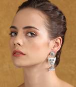 Tribal-inspired silver-plated earrings with pearl accents