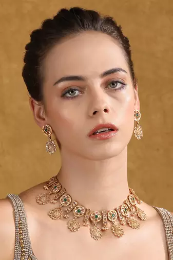 Oxidized gold-plated necklace set with intricate detailing