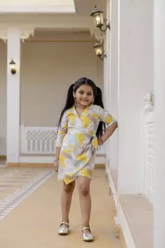 Cutiediva Girls floral printed jumpsuit in yellow