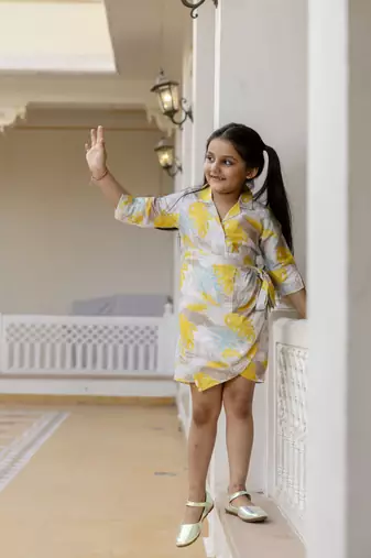 Cutiediva Girls floral printed jumpsuit in yellow