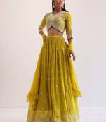 fabulous yellow sequins embroidered georgette haldi wear lehenga choli
