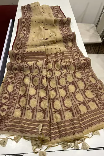 Cream soft muga cotton weaving saree with zari woven butties
