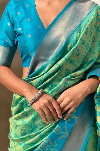 Sea green wevon meenakari ikkat patola silk blendceremonial saree
