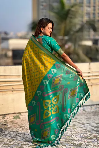 Green wevon meenakari ikkat patola silk blendceremonial saree