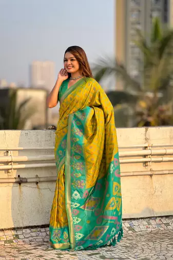 Green wevon meenakari ikkat patola silk blendceremonial saree
