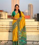 Mustard wevon meenakari ikkat designer patola silk blendceremonial saree