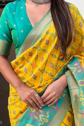 Mustard wevon meenakari ikkat patola silk blendceremonial saree