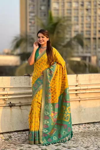 Mustard wevon meenakari ikkat patola silk blendceremonial saree