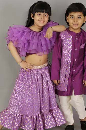 Purple organza frilled blouse with cotton zari lehnga