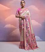 White banarasi silk blend weaving saree with zari woven fancy tassels