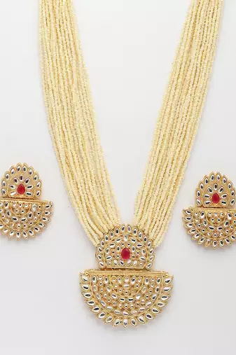  women's gold toned red stones & kundan studded jewellery set