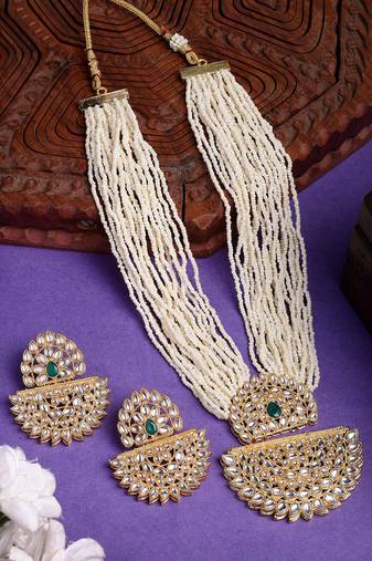  women's gold toned green stones & kundan studded jewellery set