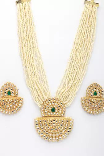  women's gold toned green stones & kundan studded jewellery set