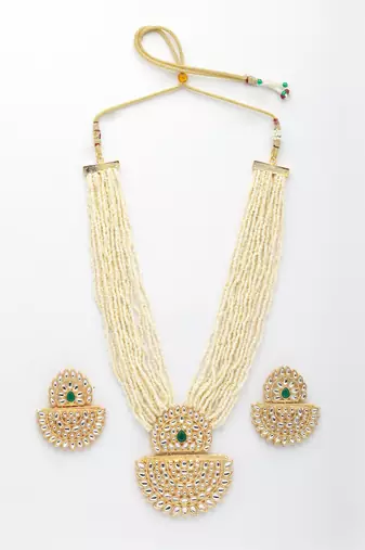  women's gold toned green stones & kundan studded jewellery set