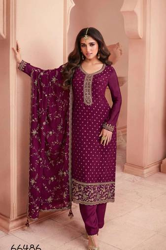 Magenta heavy embroidery dola silk semi stitched suits