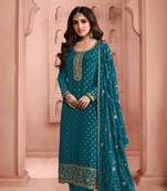 Peacock blue heavy embroidery dola silk semi stitched suits