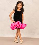 Sophisticated black velvet a-line dress with pink taffeta flower accents