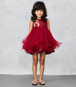 Maroon lacy dress with floral embellishments on chest