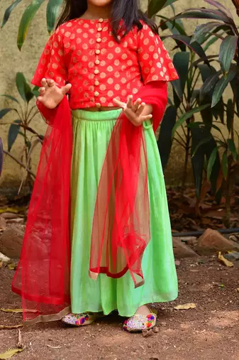 Red top with green skirt