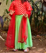 Red top with green skirt