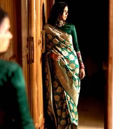 Green color silk blend saree with blouse