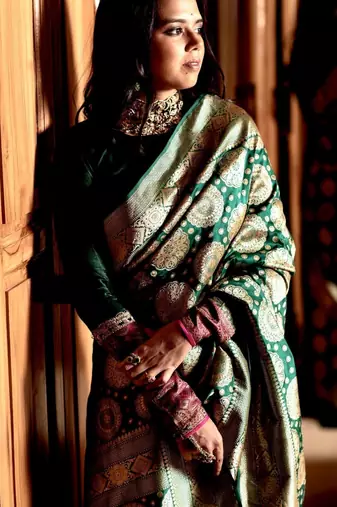 Green color silk blend saree with blouse