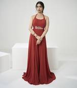 Rust orange jumpsuit with short cape