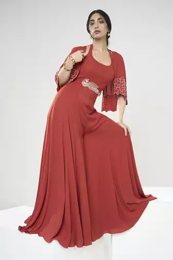 Rust orange jumpsuit with short cape