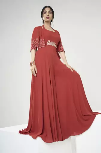 Rust orange jumpsuit with short cape