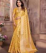 Yellow organza c wevon jari heavy ceremonial saree