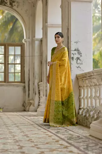 Yellow raw silk blend c wevon ikat ceremonial saree