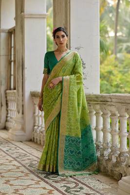 Green raw silk blend c wevon ikat ceremonial saree 1