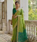 Green raw silk blend c wevon ikat ceremonial saree