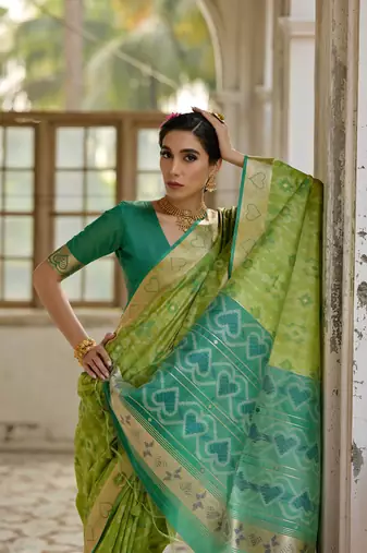 Green raw silk blend c wevon ikat ceremonial saree