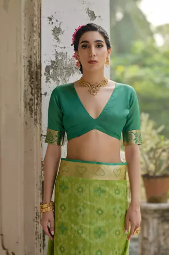 Green raw silk blend c wevon ikat ceremonial saree